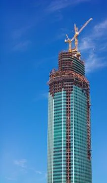 Skyscraper develop on sky background Stock Photos