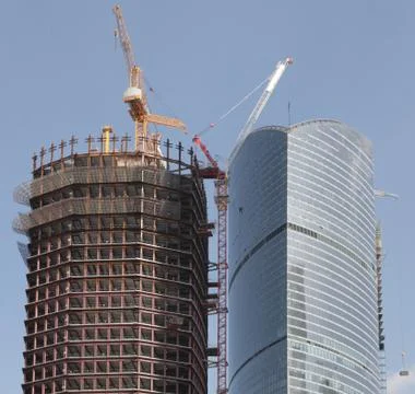 Skyscraper develop on sky background Stock Photos