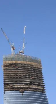 Skyscraper develop on sky background Stock Photos