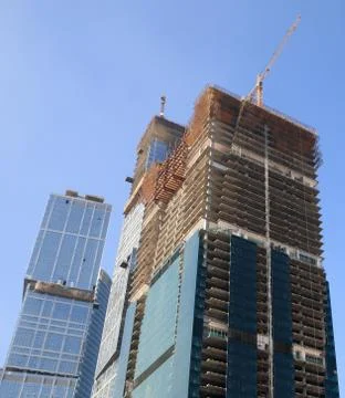 Skyscraper develop on sky background Stock Photos