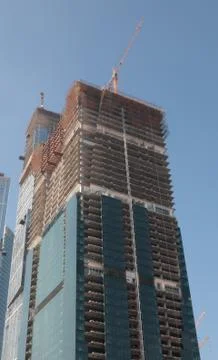 Skyscraper develop on sky background Stock Photos