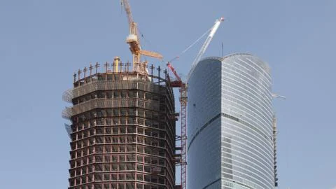 Skyscraper develop on sky background Stock Photos