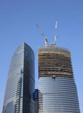 Skyscraper develop on sky background Stock Photos