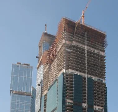 Skyscraper develop on sky background Stock Photos