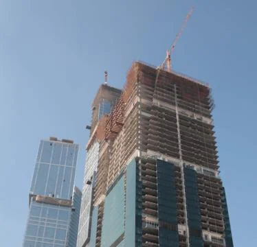 Skyscraper develop on sky background Stock Photos