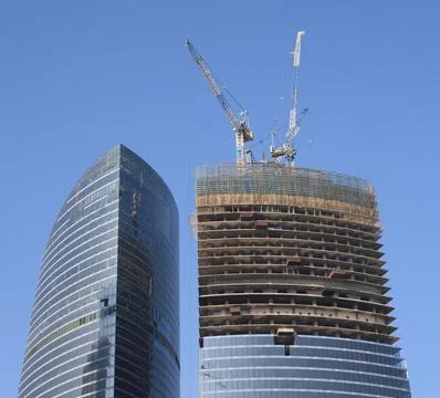 Skyscraper develop on sky background Stock Photos