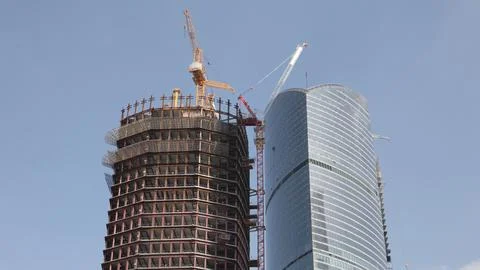 Skyscraper develop on sky background Stock Photos