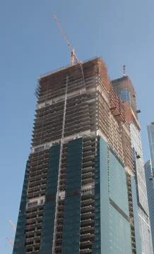 Skyscraper develop on sky background Stock Photos