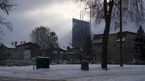 Skyscraper downtown winter clouds snow crane left estabilishing shot Stock Footage 92144849
