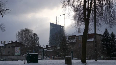 Skyscraper downtown winter clouds snow birds crane left long Video stock 92145006