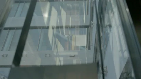 Skyscraper elevator traveling from top to bottom Stock Footage 64553798