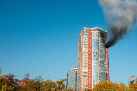 Skyscraper fire accident. Concept of firefighting problems at the height. Thi Photos