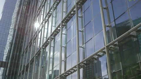 Skyscraper glass wall reflected sun beams. Stock Footage 221459282