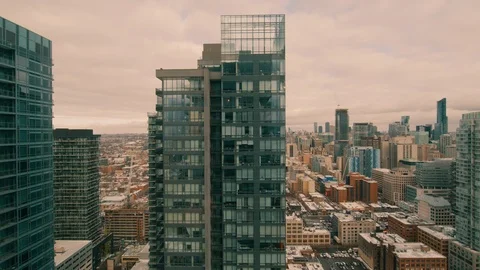 Skyscraper from high floor tilt down to ground through window Stock Footage 101485455