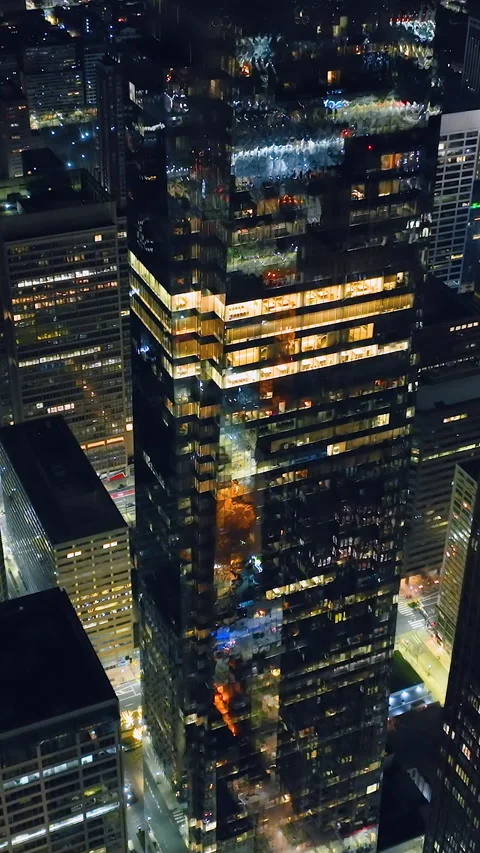 Skyscraper with large glass windows facades and lights. Aerial View 스톡 동영상 267719807