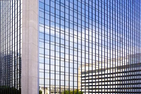 Skyscraper with light reflection of modern buildings and blue sky in citysc.. Stock Photos