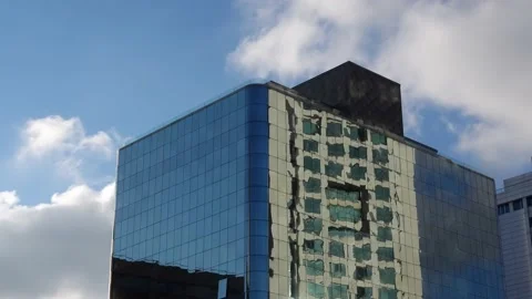 Skyscraper looming with clouds, hyper lapse Stock Footage 143437603