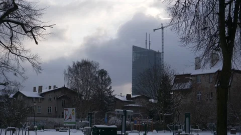 Skyscraper medium tracking estabilishing shot left winter snow cloudy Stock Footage 92144827