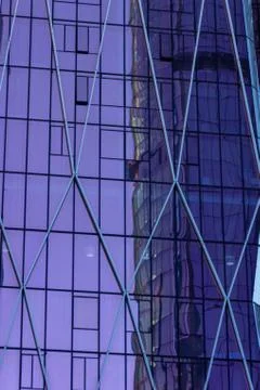 Skyscraper with mirror surface which reflects other building on the opposite  Photos