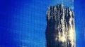 Skyscraper mirroring close up exterior glass facade blue sky sun reflection 4k or 4k+ Resolution