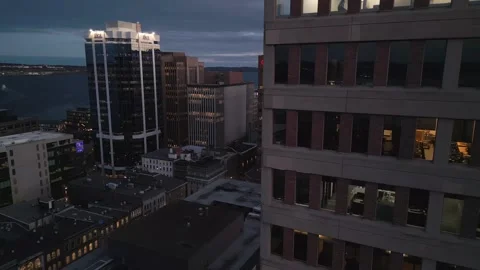 Skyscraper office building at night, worker working overtime, aerial view. Vídeo Stock 256611592
