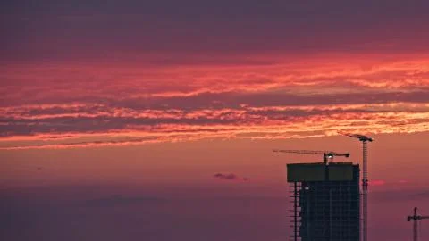 Skyscraper or Construction site with red color izmir sunset. Stock Photos
