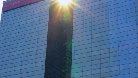 Skyscraper or modern office building with sunlight Stock Footage 123971861