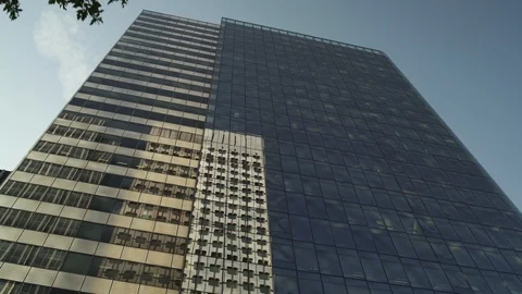 Skyscraper reflection with blue glass windows at business district in Paris, low Stock Footage 119361951