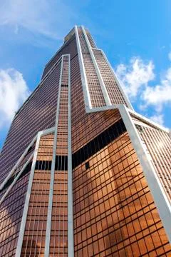 The skyscraper with the reflection of the blue sky in the Windows Stock Photos