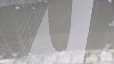 Skyscraper Reflection Puddle Boot Walk Through Stock Footage 71284651