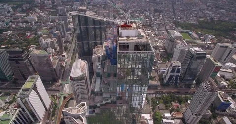 Skyscraper Rooftop Crane In Silom District, Bangkok, Thailand, Aerial Push Stock Footage 80245869