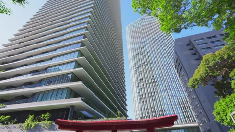 Skyscraper stands beyond the Torii Gate at Toranomon Hills in Tokyo Stock Footage 280734183