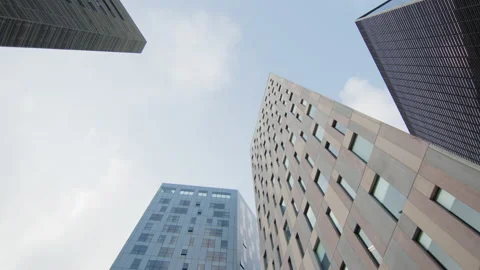 Skyscraper summit with blue sky behind, in a modern business district Stock Footage 220737880