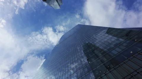 A skyscraper symbolizes innovation in urban development, standing tall against Stock Footage 281085363