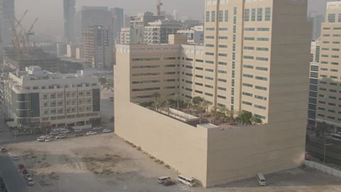 Skyscraper with terrace in Dubai, surrounded by construction work 動画素材 289657887
