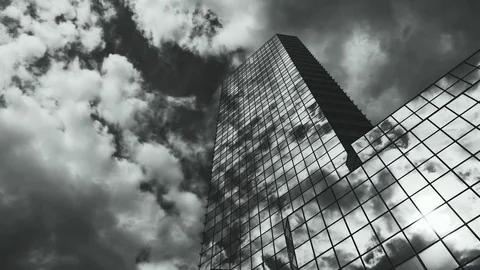Skyscraper TimeLapse. The storm clouds floating over the skyscrapers Stock Footage 77640809