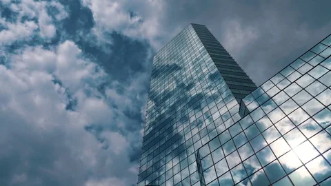 Skyscraper TimeLapse. The storm clouds floating over the skyscrapers Stock Footage 77640810