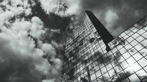 Skyscraper TimeLapse. The storm clouds floating over the skyscrapers Video stock 77640811