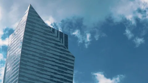 Skyscraper TimeLapse. The storm clouds floating over the skyscrapers Stock Footage 77640820