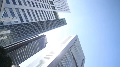 Skyscraper in Tokyo Japan. Spinning camera. Clear beautiful sky. Stock Footage 220098469
