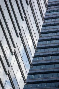 Skyscraper wall abstract background with repeated rectangular cells, mirrored Stock Photos