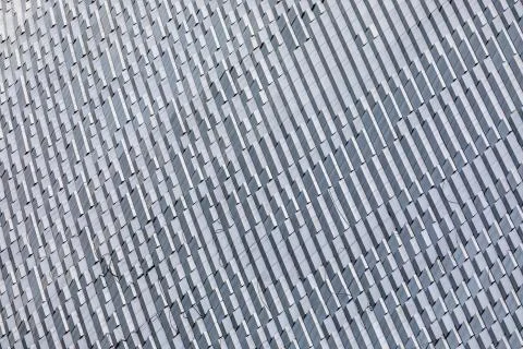 Skyscraper wall abstract background with repeated rectangular cells. Metal gr Stock Photos