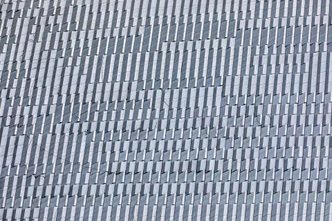 Skyscraper wall abstract background with repeated rectangular cells. Metal gr Foto stock
