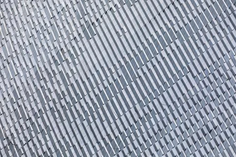 Skyscraper wall abstract background with repeated rectangular cells. Metal gr Foto stock