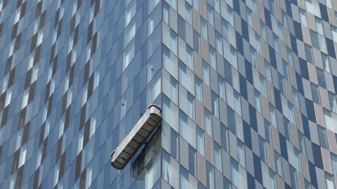 Skyscraper window cleaners working from ... | Stock Video | Pond5