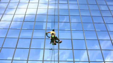 Skyscraper window glass cleaner Stock Footage 32423259