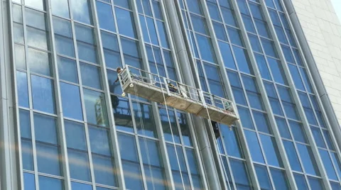Skyscraper window glass cleaner Stock Footage 64764667