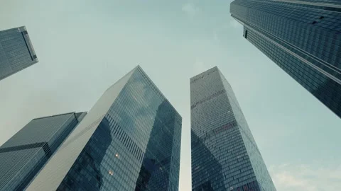 Skyscrapers against the sky , zoom out , timelapse Stock Footage