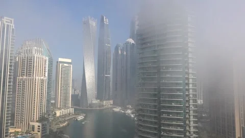 Skyscrapers in the fog and clouds hyper lapse, Dubai Marina Stock Footage 146784232
