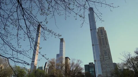 Skyscrapers harmoniously integrated and surrounded by the beauty of nature 스톡 동영상 291632253